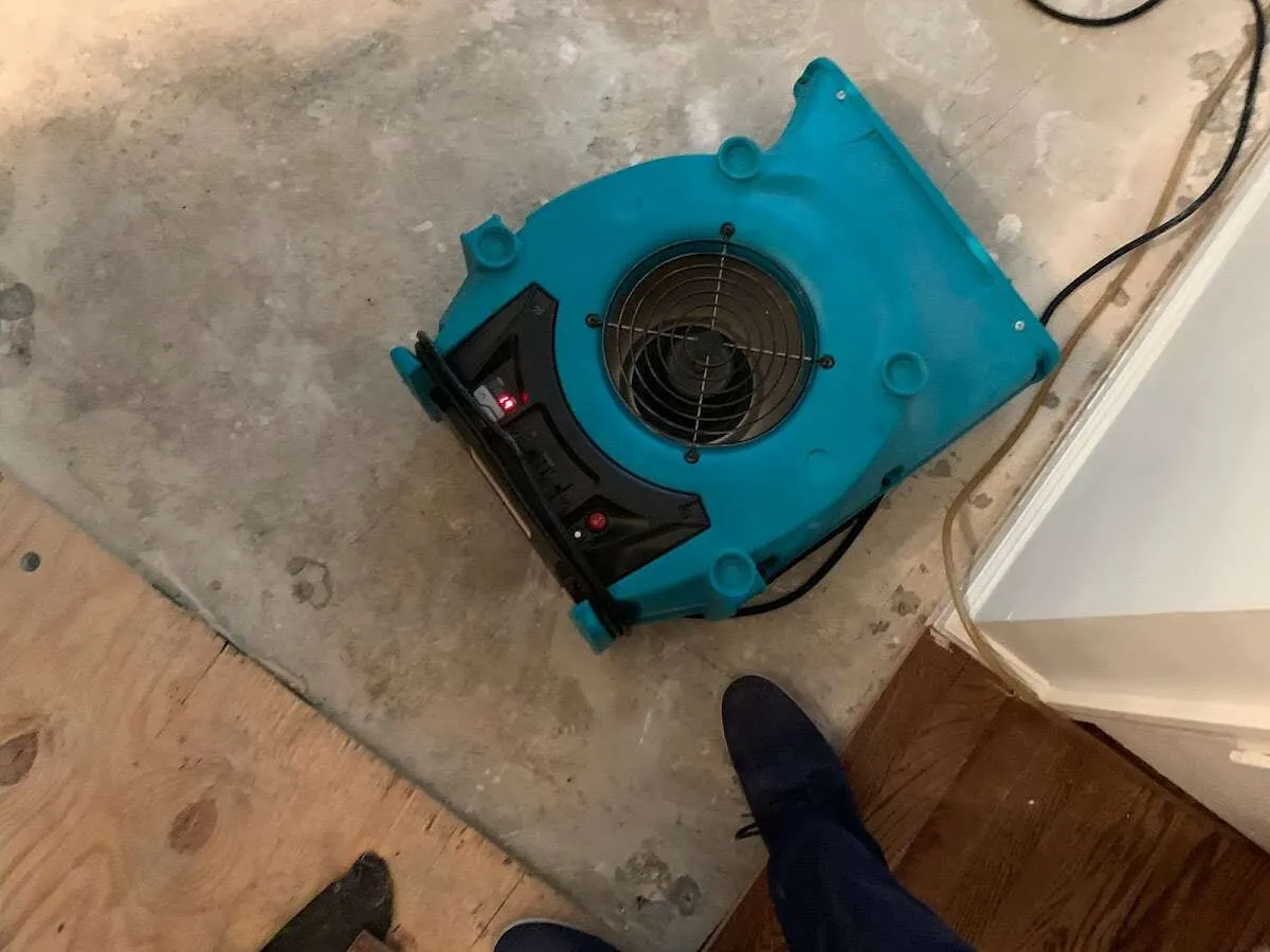 Air mover drying subfloor during Leak Detection & Repair in Payette